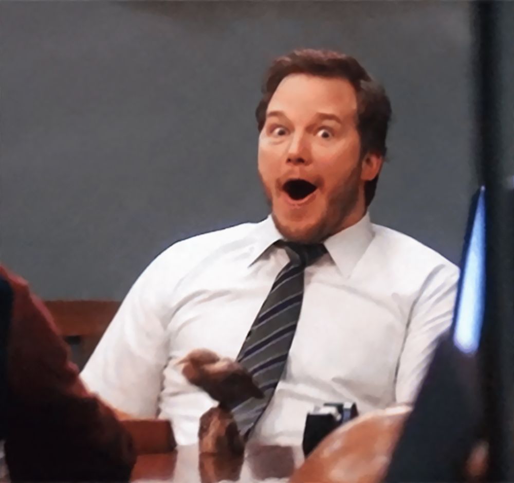 A man in a shirt and tie looking shocked into the camera.